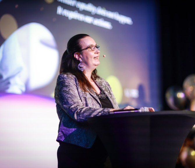 Susanna Bairoh giving her keynote speech at NWiTA 2025.