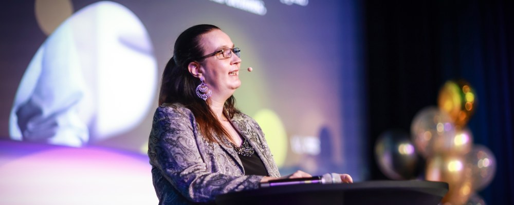 Susanna Bairoh giving her keynote speech at NWiTA 2025.