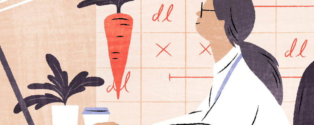 Piirroksessa henkilö näpyttelee tietokonetta, kannustimenaan porkkana.