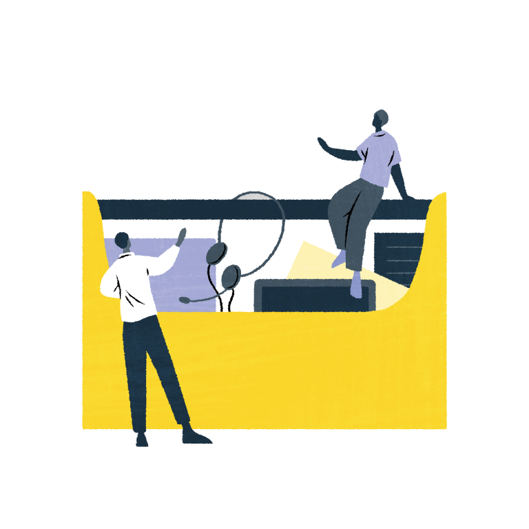 Piiroskuvassa kaksi henkilöä keskustee työkalupakin äärellä.